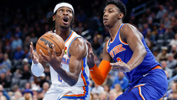 Nov 21, 2022; Oklahoma City, Oklahoma, USA; Oklahoma City Thunder guard Shai Gilgeous-Alexander (left) controls the ball against New York Knicks guard RJ Barrett (right) during the second half at Paycom Center. New York won 129-119. Mandatory Credit: Alonzo Adams-USA TODAY Sports